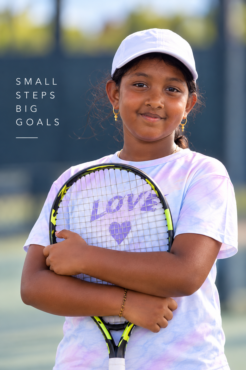 Priyanka Suresh holding her tennis racquet on the court
